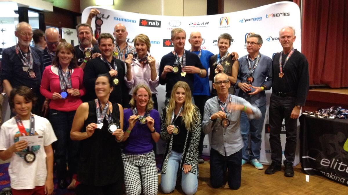 GROUP SUPPORT: Jervis Bay Trialhlon Club medallists show off their prizes from the Elite Energy Tri Series at Port Stephens last weekend. 
