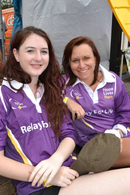 Nicole Giffard from Cambewarra and Karen Fishpool from Berry take a short break from their laps at the Relay For Life at the Shoalhaven Entertainment Centre on Saturday.