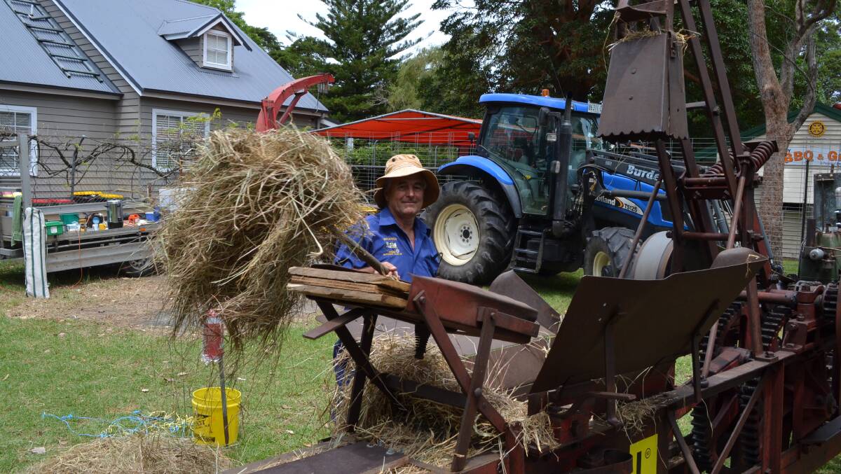 Barry Holmesby from Tomerong with his almost century old, stationary hay baler on display at this year’s Berry Show.