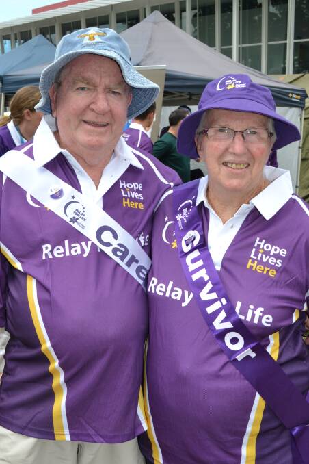 John and Helen Martin from North Nowra walk the Relay For Life with pride at the Shoalhaven Entertainment Centre on Saturday.