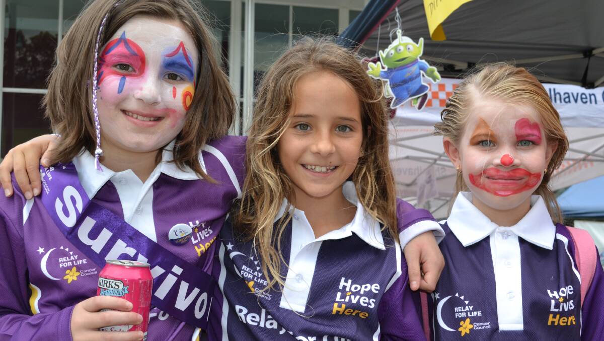 Belle Jeffrey from Cambewarra, Fleur Hussein from Vincentia and Clancy Whelan from Cambewarra walk for the fight against cancer at the Relay For Life at the Shoalhaven Entertainment Centre on Saturday.