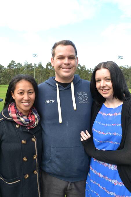 RUGGED UP AGAINST THE WIND AND RAIN during the Shoalie’s home games against eh Vikings at Shoalhaven Rugby Park on Saturday are Jane Visesio from Sydney with Brenton Clarke and Samantha Foley from Gerringong. 
