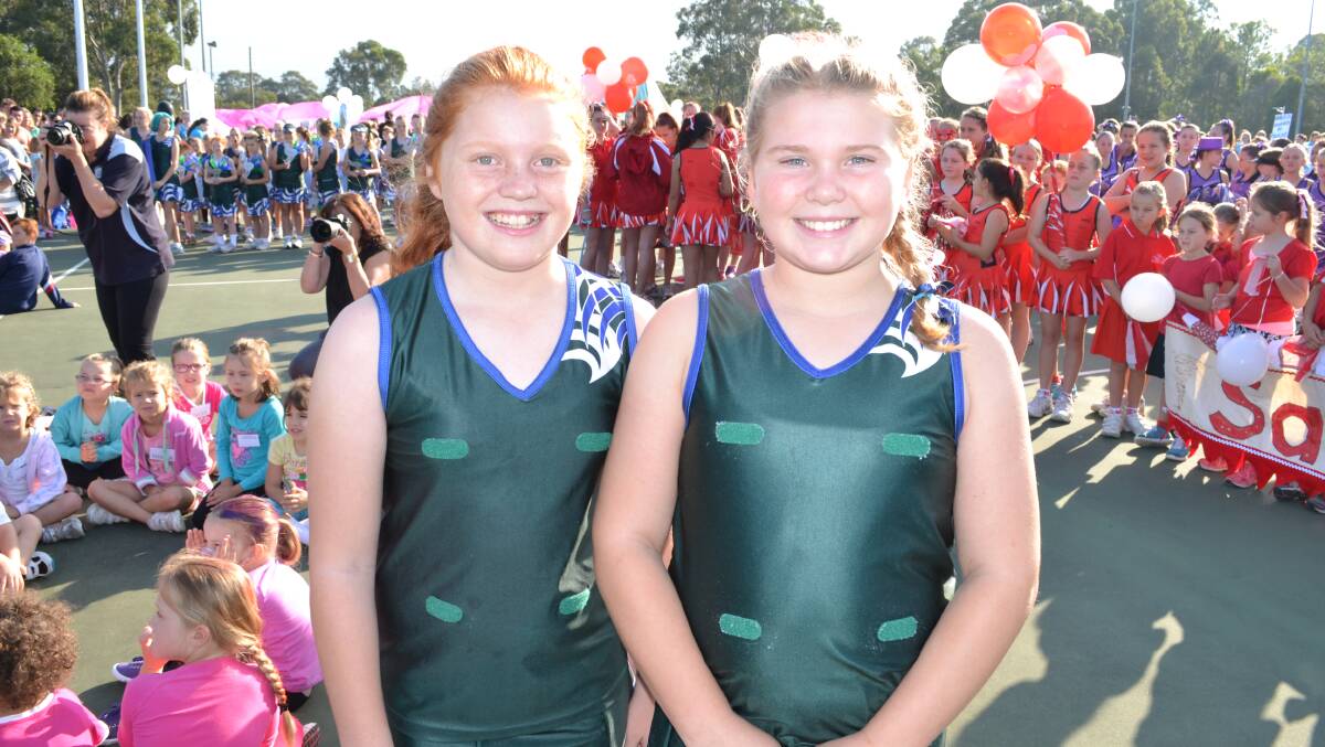 RUNNER UP: Georgia Henderson and Grace Hughes from Lyrebirds claim the runner-up prize for best marching team at the Shoalhaven Netball March Pass, marking the beginning of the netball season on Saturday.
