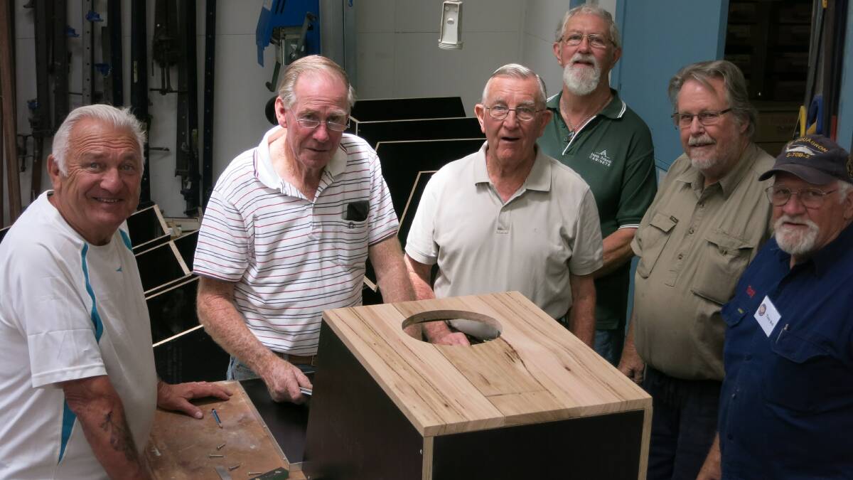 HELPING HAND: Berry Men’s Shed members Ric Dodds, Terry Smith, Peter Johnstone, Bob Mathieson, John Hudson and Tony Bell construct the first of 45 nesting boxes to house animals who will lose their homes due to the Berry bypass construction.