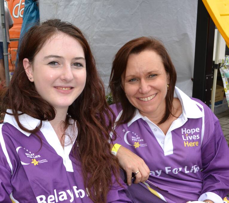 BREAK: Nicole Giffard from Cambewarra and Karen Fishpool from Berry take a short break from their laps at the Relay For Life at the Shoalhaven Entertainment Centre on Saturday.