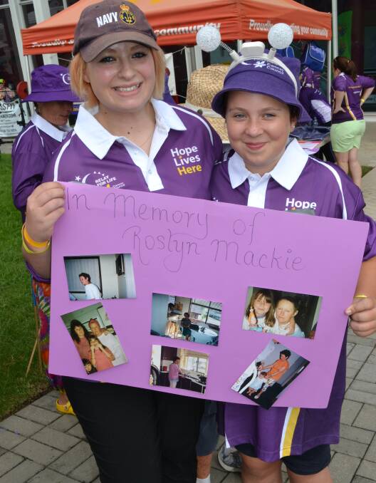 IN MEMORY: Ebony and Ella Reid from Basin View remember those lost to cancer at the Relay For Life at the Shoalhaven Entertainment Centre on Saturday.