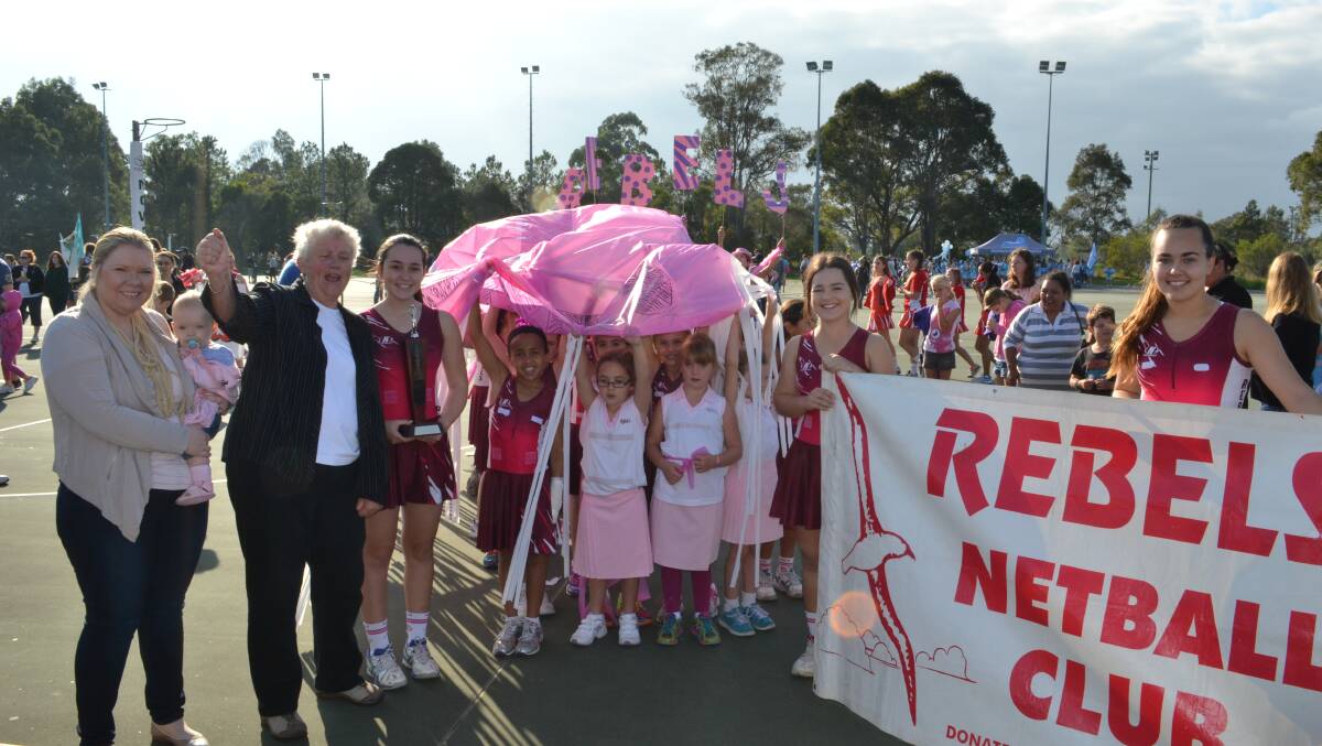 WINNERS: Clr Jenna Tribe and Mayor Joanna Gash congratulate the Rebels Netball Club team, Erin Villagra, Olivia and Monique Liberale for winning the trophy for best March Pass at the beginning of the netball season at the Shoalhaven Netball courts on Saturday.
