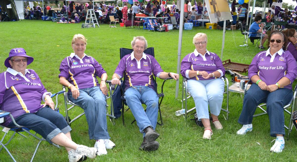 LIONS: Sue Pearson, Wendy Roberts, John Brown, Robyn Hunt and Marie-Anne Watson from Jervis Bay Lions take a short break at the Relay For Life at the Shoalhaven Entertainment Centre on Saturday.