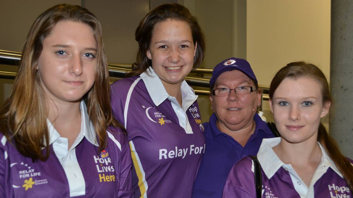 LINKS: Maddi Bart, Tanisha Toth, Leah Walker and Charleen Toth from Old Erowal Bay link together in a lap around the Shoalhaven Entertainment Centre for Relay For Life on Saturday.