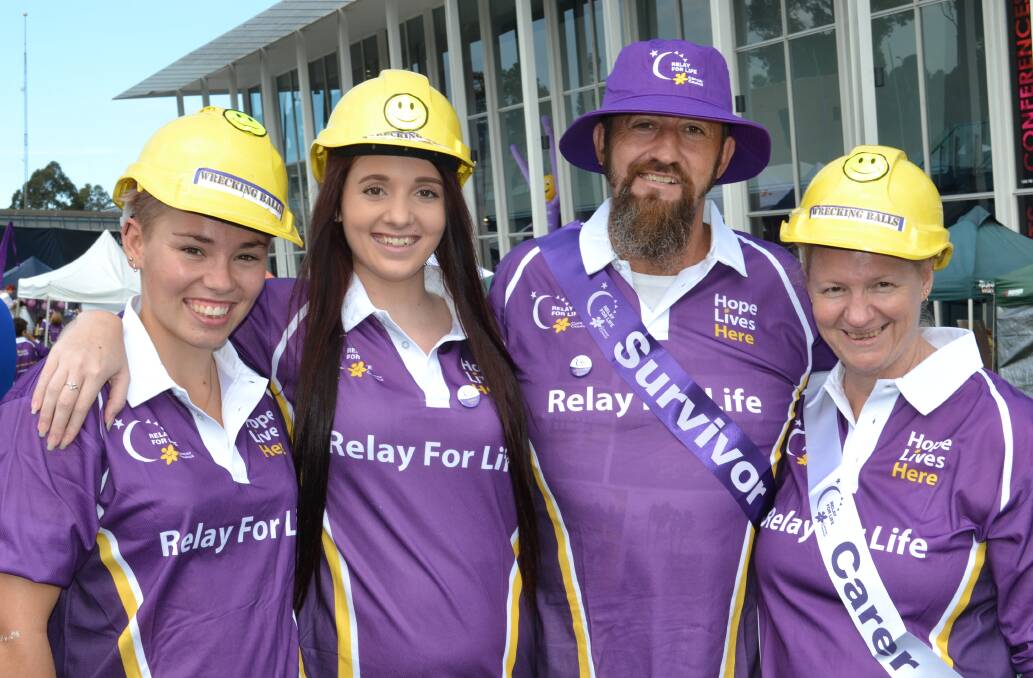 ENDURE: Taron Wheeler, Emily, Andrew and Rhonda Johnston from Sanctuary Point make a stand against cancer at the Relay For Life at the Shoalhaven Entertainment Centre on Saturday.