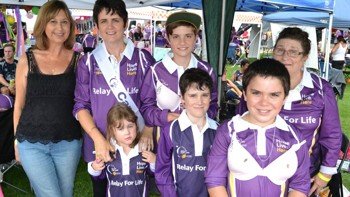FOR A CAUSE: Penny Wakefield from Bomaderry, Janine, Aaron, Kaye, Grace and Liam Armstrong with Will White from Worrigee raise cancer awareness at the Relay For Life at the Shoalhaven Entertainment Centre on Saturday.