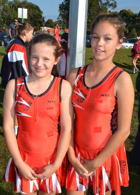 NETBALL: Imogen Jackson and Ruby Dowdy from Saints Netball Club enjoy the march before the games kick off at the Shoalhaven Netball March Pass on Saturday.