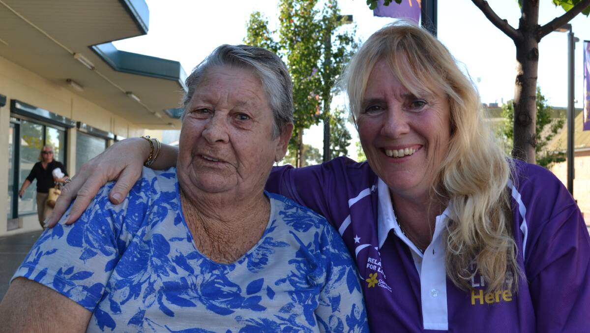 RELAY FOR LIFE TEAM LEADER Debbie Warner from Worrigee organised the fundraiser held on Saturday at Junction Court. She sits to the right of her friend Christina Gabbes from Nowra who came to give her support. 