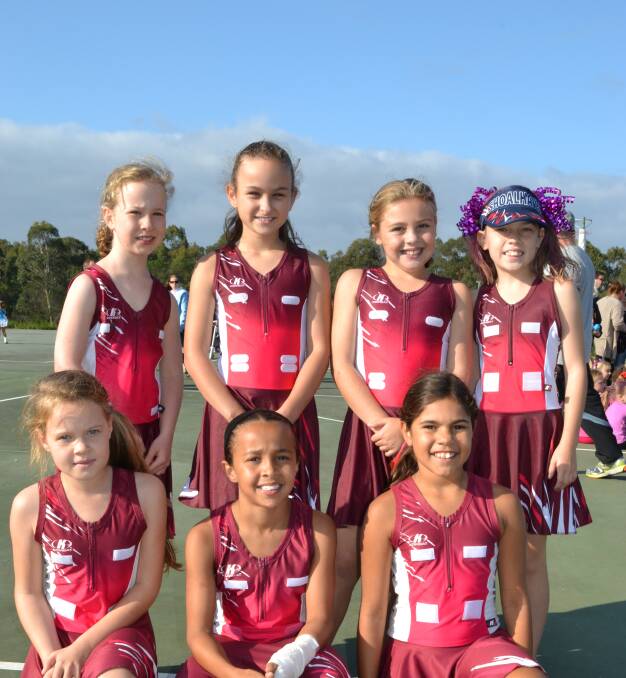 GOAL DEFENCE: Amy Rutjens, Jessica Trost, Chloe Couley and Charlize O’Toole, (front) Emily Evison, Rheya Luke and Molly Wellington get in to the team spirit at the March Pass for the beginning of the Shoalhaven netball season on Saturday.