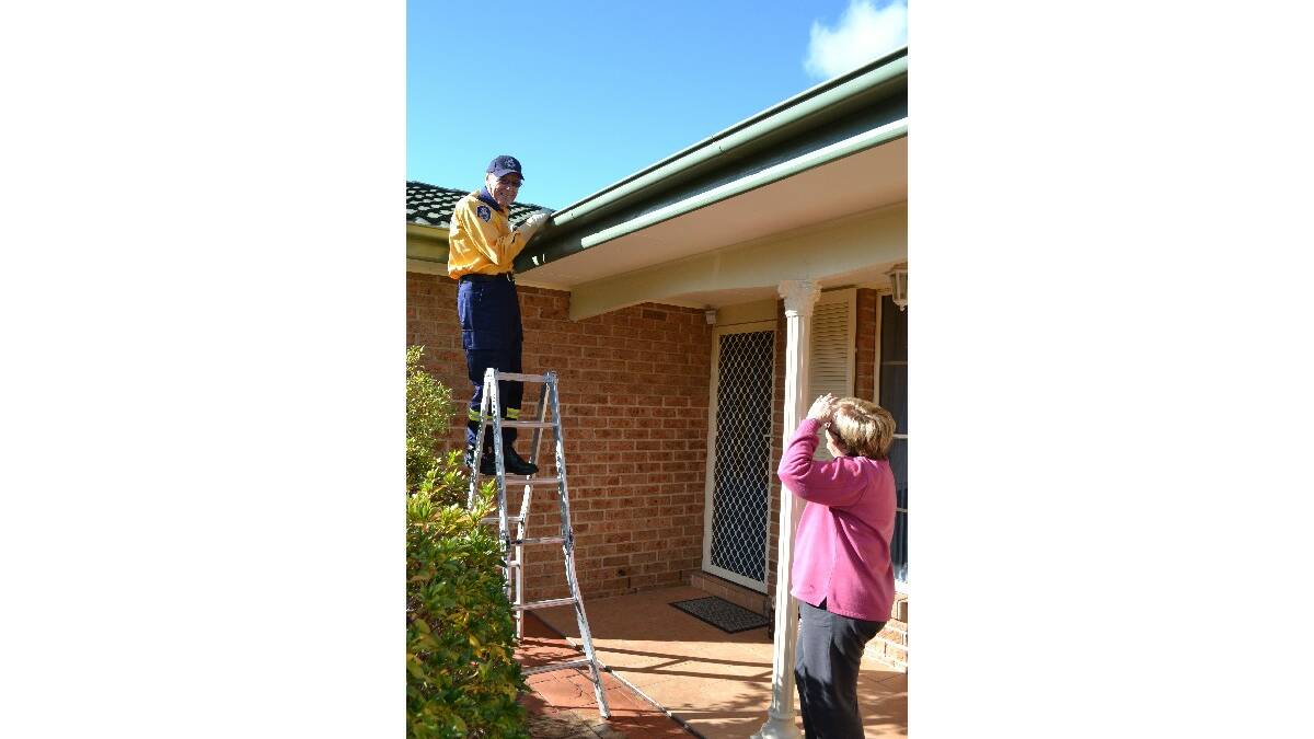 RFS Shoalhaven community engagement officer Tony Simmonds checks a home for a local resident as part of the AIDER Program.