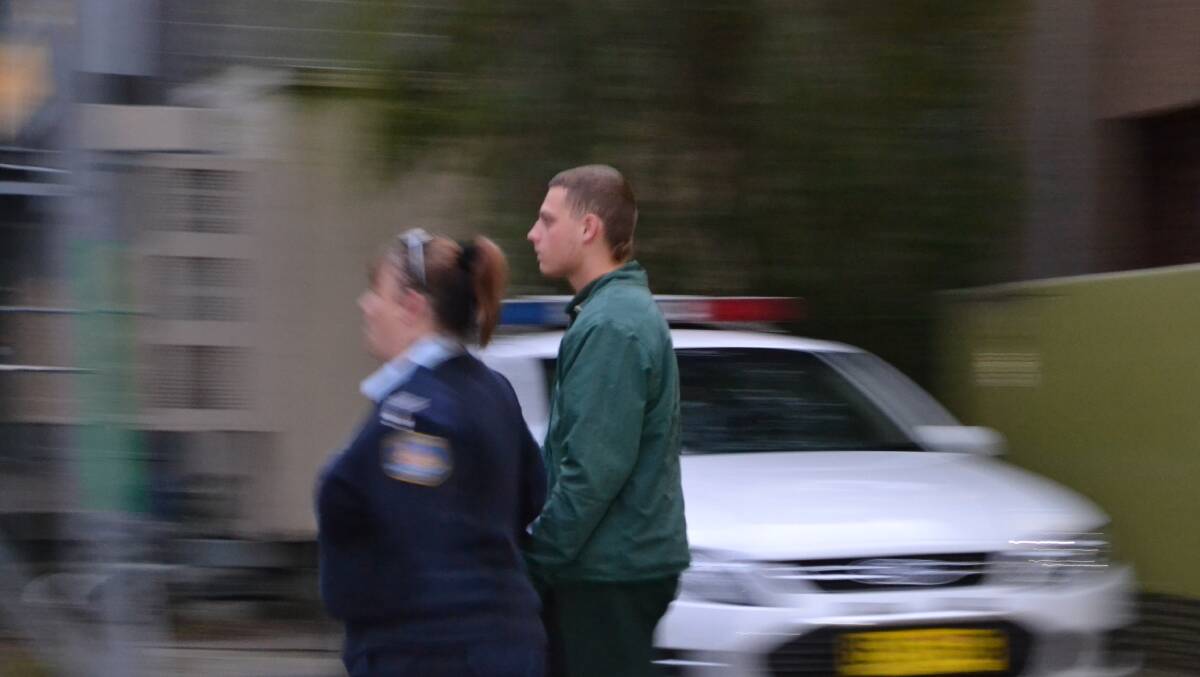 Joshua Chamberlain is led from the Nowra Police Station. He will  be sentenced Friday in Nowra District Court over the bashing of North Nowra man Francois Beugels.