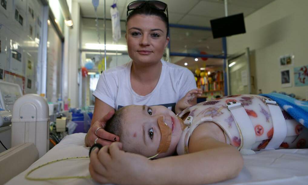 Bomaderry's Sarah O'Meara with her son Jake Price, 3, who is recovering after suffering head and spinal injuries in a car accident in April. Photo: DALLAS KILPONEN