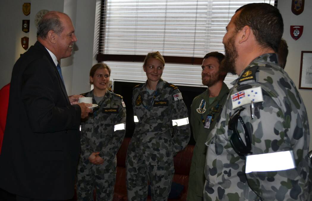 Defence Minister David Johnston meets HMAS Albatross personnel during his visit to the base on Thursday where he announced a $700 million Helicopter Aircrew Training System would be based at the Nowra naval air station.