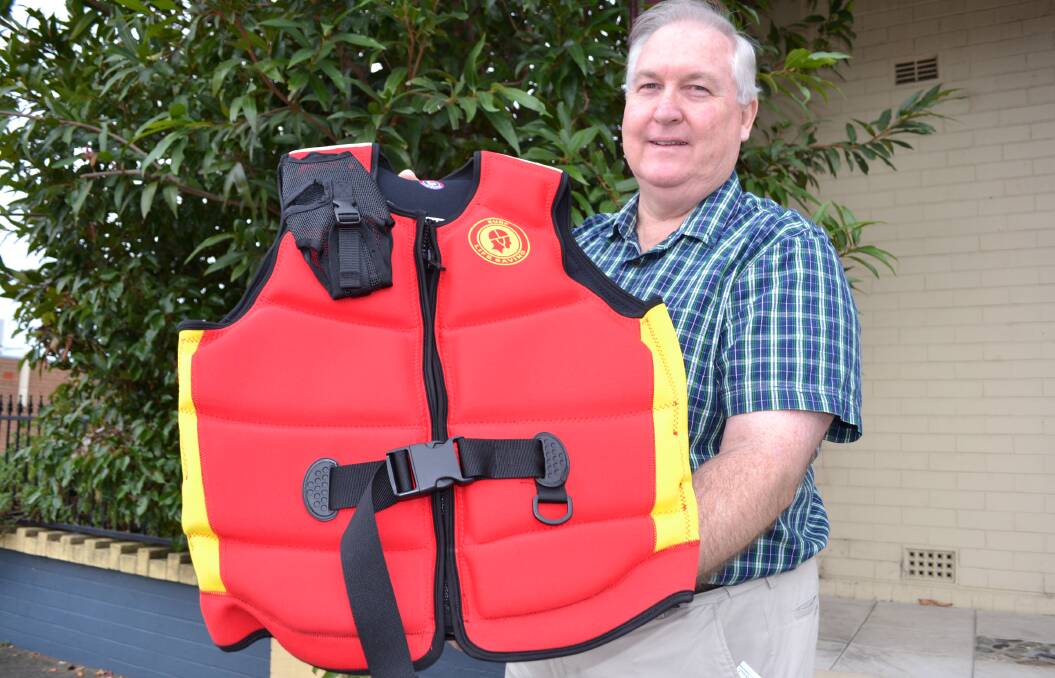 South Coast Surf Lifesaving president Steve Jones with one of the new personal flotation devices (PFD) which will be provided to all branch clubs thanks to support from the Veolia Mulwaree Trust.