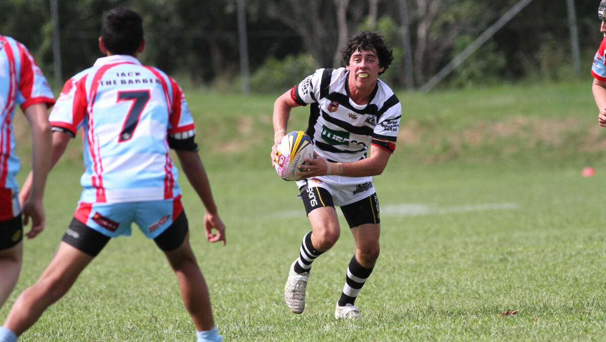 ULLADULLA: Declan Healy from the Berry under 198s looks for a way through the Milton Ulladulla defence in their rugby league game played at Mollymook Oval on Sunday.