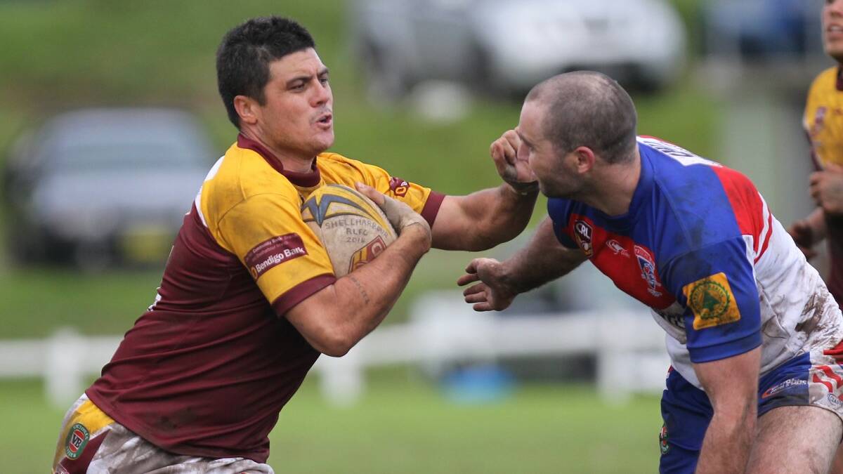 SHELLHARBOUR: Shellharbour centre Bronx Goodwin tries to fend off his opposite number Peter Cronin during Sunday’s muddy battle at Shellharbour
