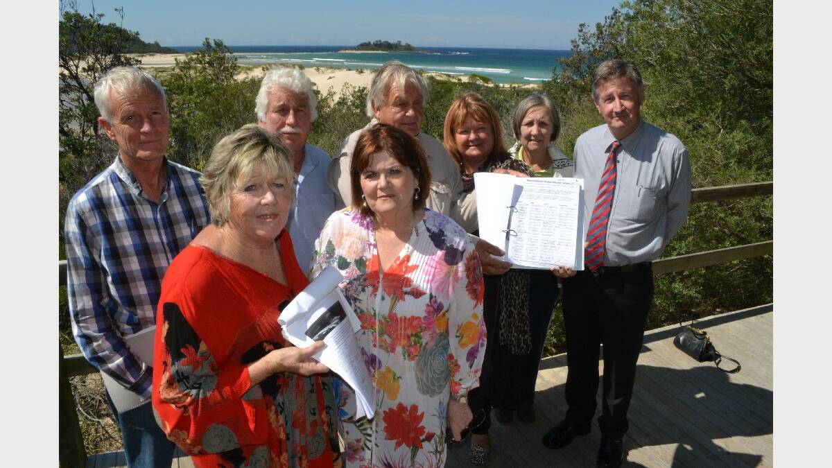 ULLADULLA:  Handing over petitions to State Member for South Coast are Lake Conjola and Sussex Inlet representatives Dr Michael Brungs, Robyn Kerves, Colin Ashford, John Tucker, Cr Patricia White, Elaine Caswell and Cr Allan Baptist.