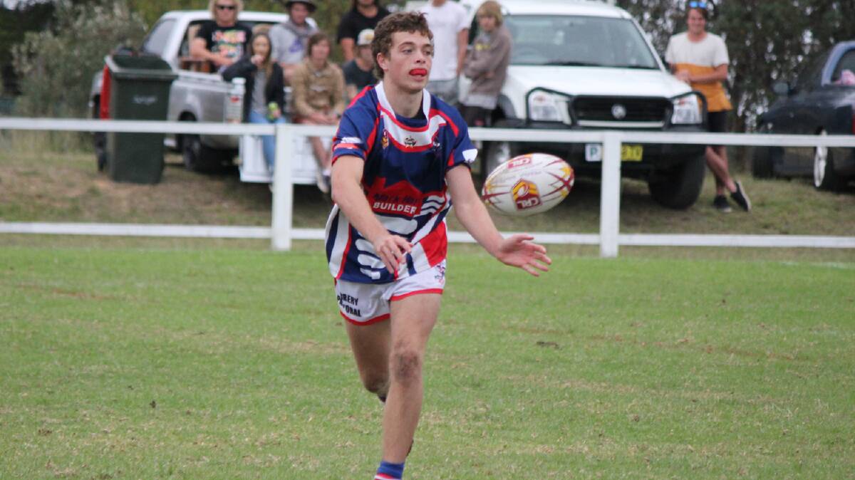 PAMBULA: Bega Rooster James Bower-Scott offloads during the under 18 clash with the Bulldogs on Saturday. 