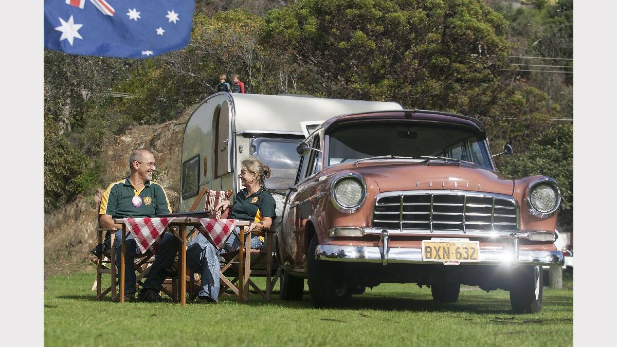 TATHRA: Bega Heritage Motor Club members Anthony and Kathy Dack show off their restored 1959 Holden SC Station Sedan and 1968 Tabbert Caravan. 