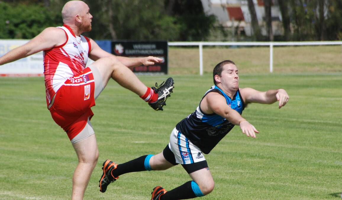 BATEMANS BAY: Luke Dudley dives to smother the ball against the Goulburn Swans. 