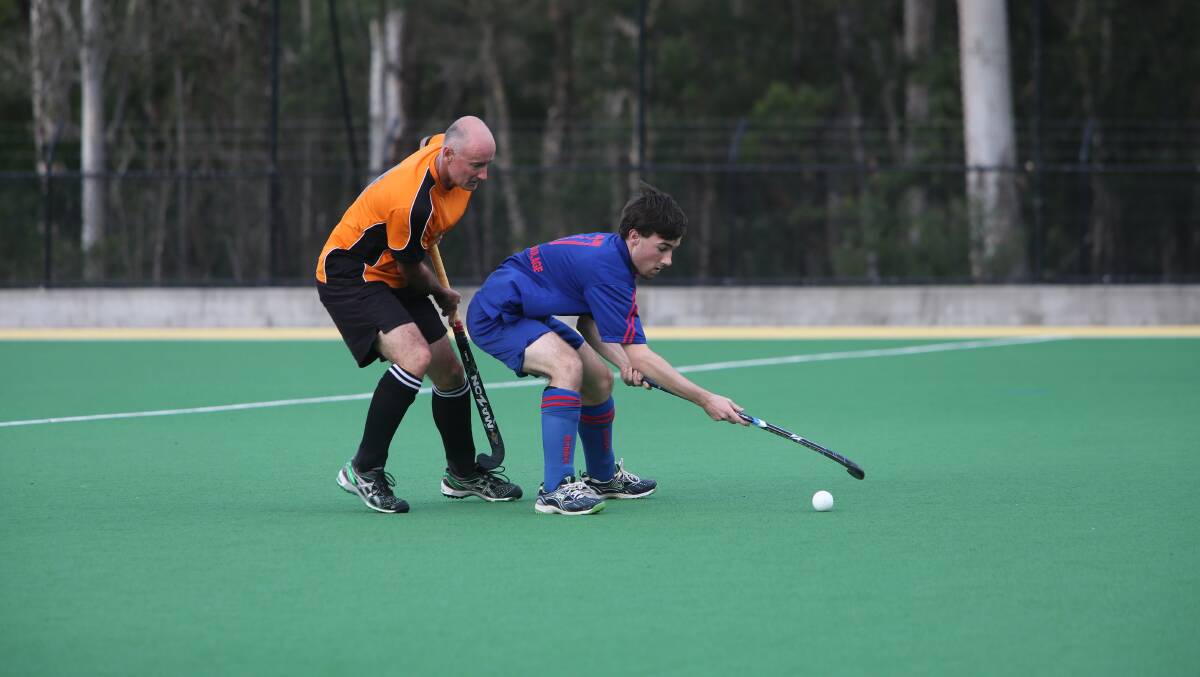 SHOALHAVEN: Allsorts’ Aaron Lloyd stays close to Burrawang’s Blake Hill in the team’s Shoalhaven Hockey grand final rematch on Saturday, which Burrawang eventually won. 
