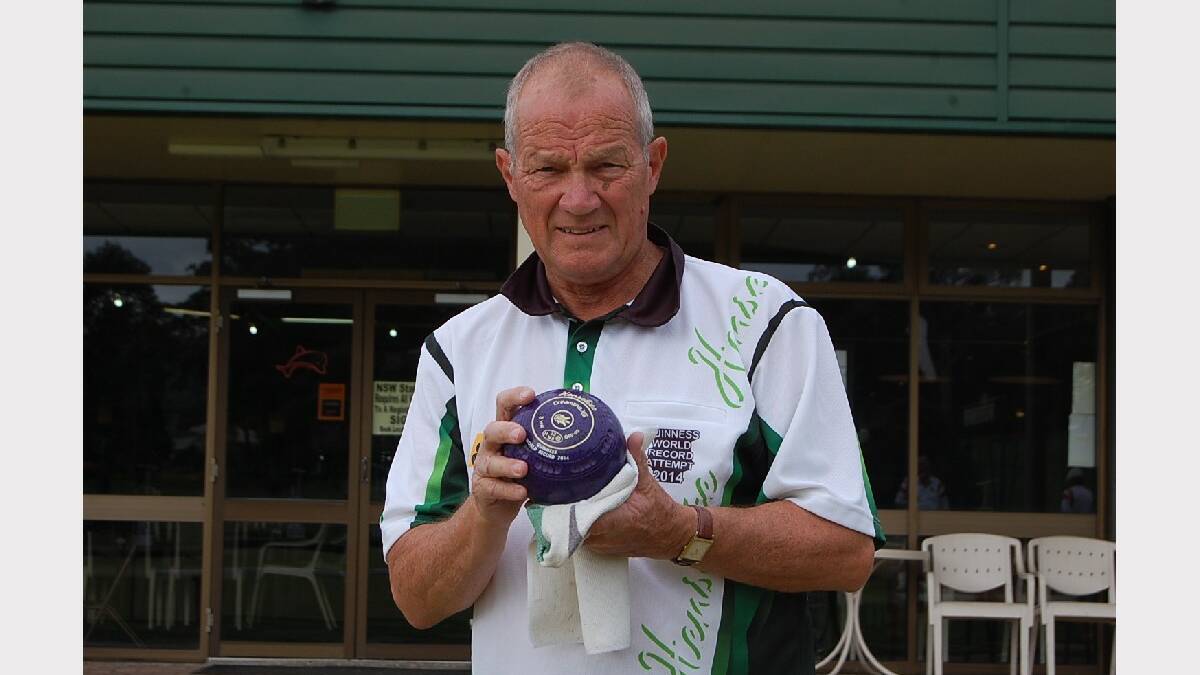 EDEN: Frank Peniguel polishes a bowl as he prepares to play at the Eden Gardens Country club; number 144 in his Guinness World Record attempt.