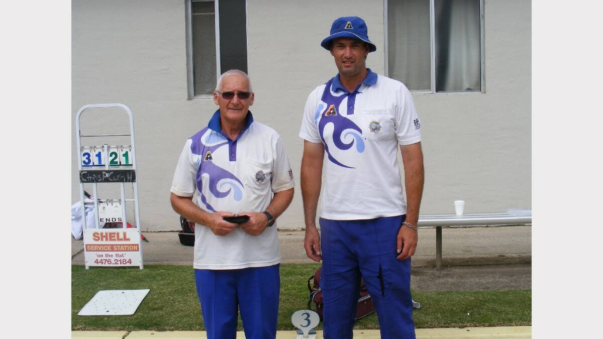 NAROOMA: Clem Hochkins, runner up this year, congratulates Chris Pollock on his win in the Narooma Men’s Bowling Club Singles Championship.