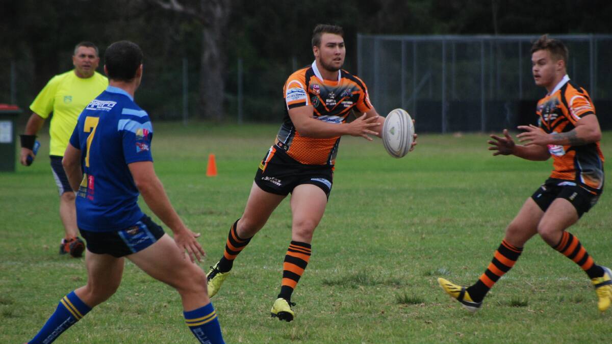 BATEMANS BAY: The Bay Tigers halfback Robert Roberts trying to break the line against the West Belconnen Warriors. 