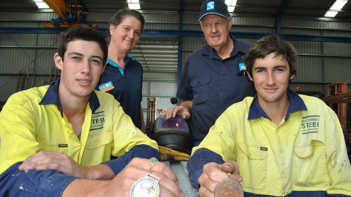 ULLADULLA: Brothers Lachlan and Steven Howes are 

joined by employers Cathie and Jim McConnell as they 

show off their Worldskills medals. 