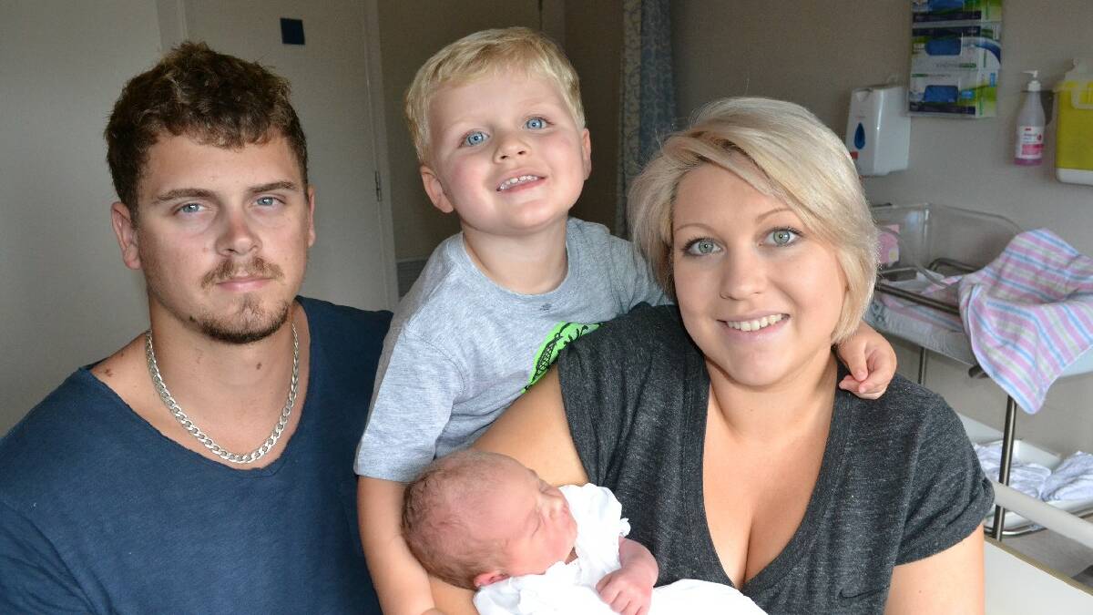 ULLADULLA: Craig, Kael and Kahlie Johnston of Kings 

Point with their special Christmas day gift, baby 

Mahly. 