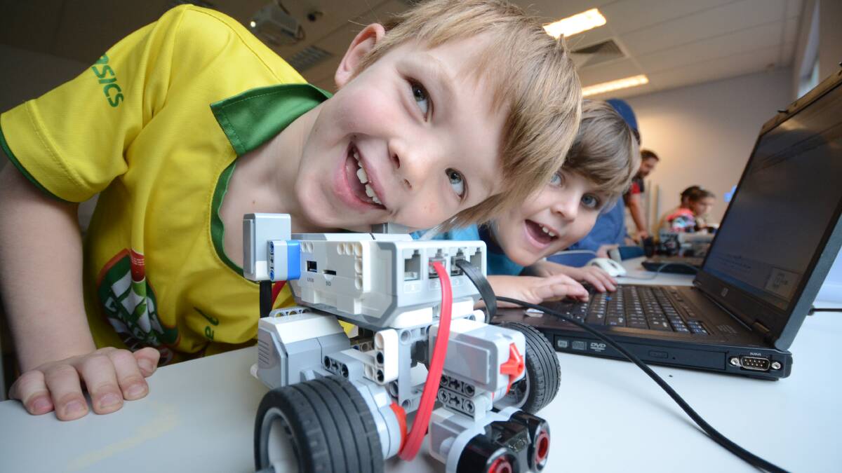 SMILES AND SCIENCE: Daniel Sim and Harrison Shepherd take their first steps on the path to becoming robotics engineers. 
