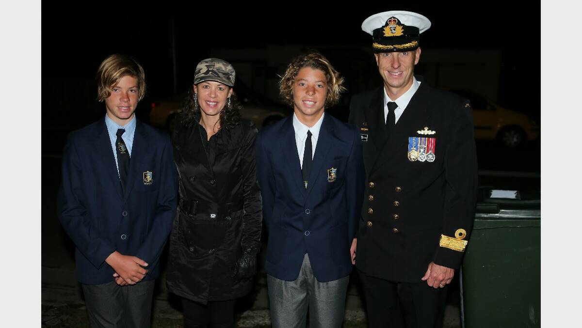 Commodore Col Lawrence with his wife Julie and sons Matt and Mitch at the Anzac Day dawn service at Greenwell Point.