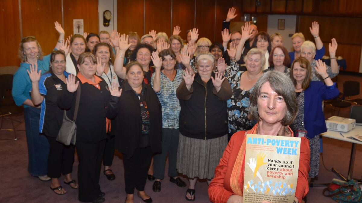 ANNUAL GATHERING: This year’s theme for Anti-Poverty Week is ‘Hands up if your council cares about poverty and hardship’. Shoalhaven Anti-Poverty Committee facilitator Judith Reardon pictured with the people who attended Shoalhaven City Council’s Anti-Poverty Week morning tea. The group was proud to raise their hands in support of council’s acknowledgement of the cause.