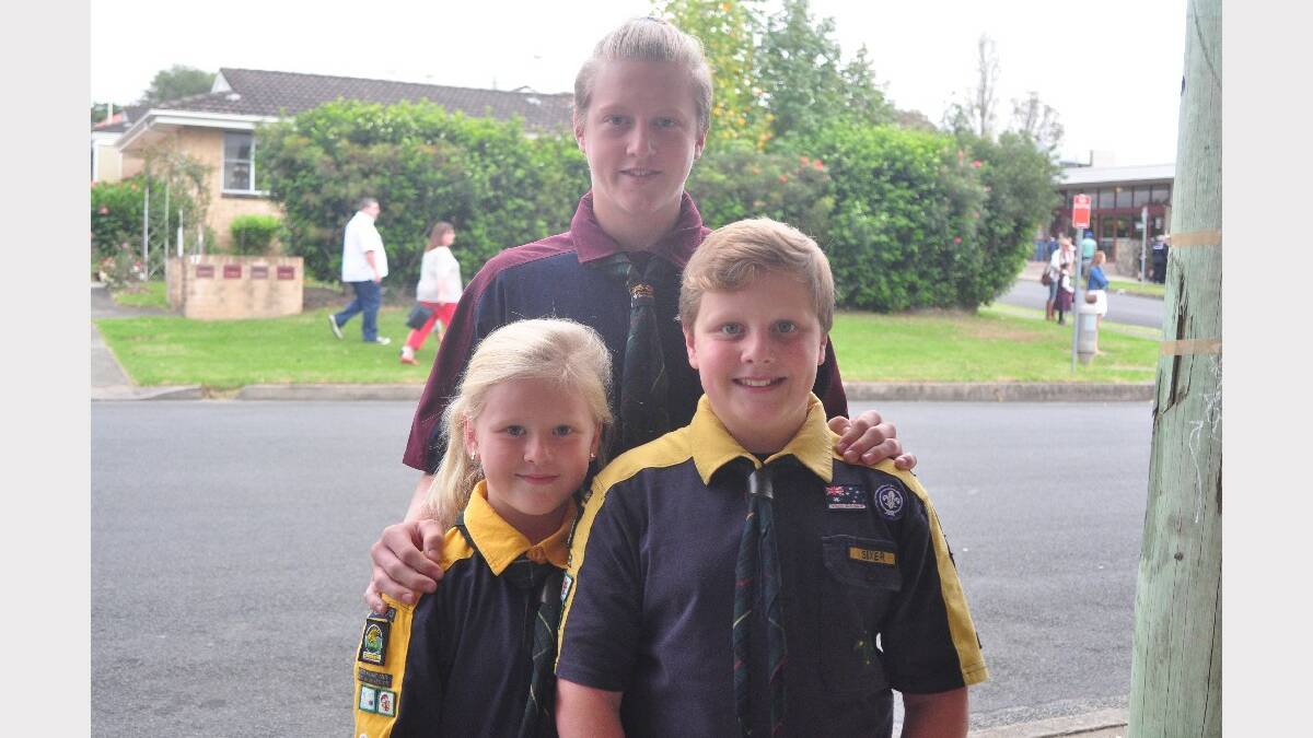 Lachlan Greig (venturer), Jacob Greig (scout) and Paige Greig (cub) represent First Illaroo Road group 