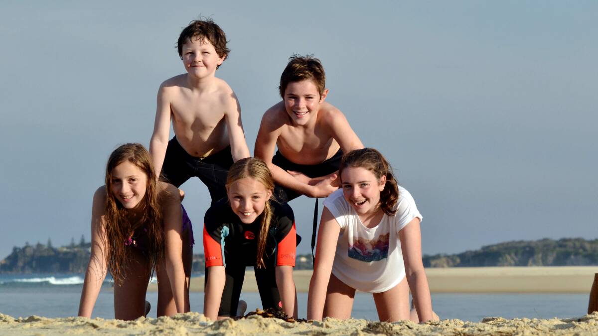 Record warm temperatures have extended the beach season for many, like these Shoalhaven children who were at Tuross on the weekend.