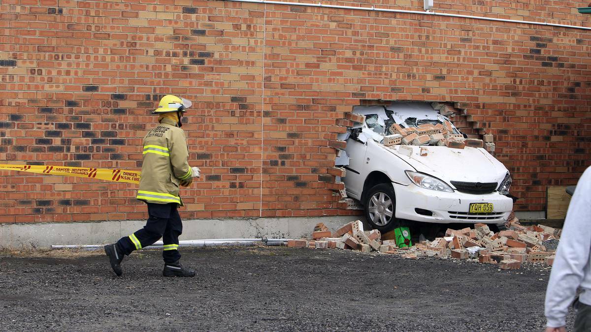 Police and emergency services responded to the Glebe Street incident where the vehicle was found to have become wedged in the back wall of the Dancespace 383 building. Picture: ANDY ZAKELI