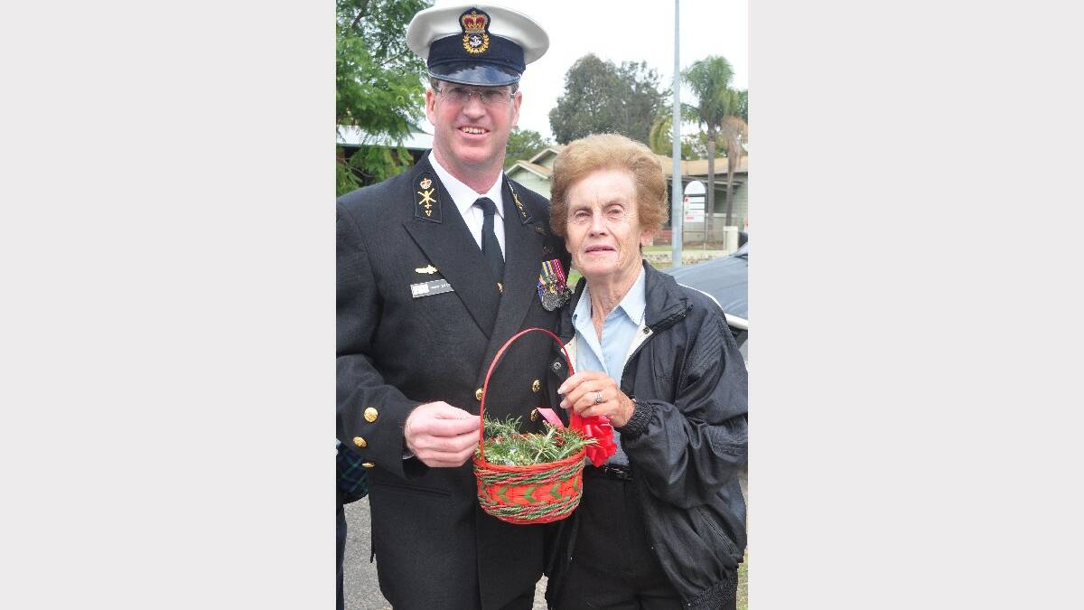 Chief Petty Officer Vincent Evans gets some rosemary from local resident Pat Crowther.
