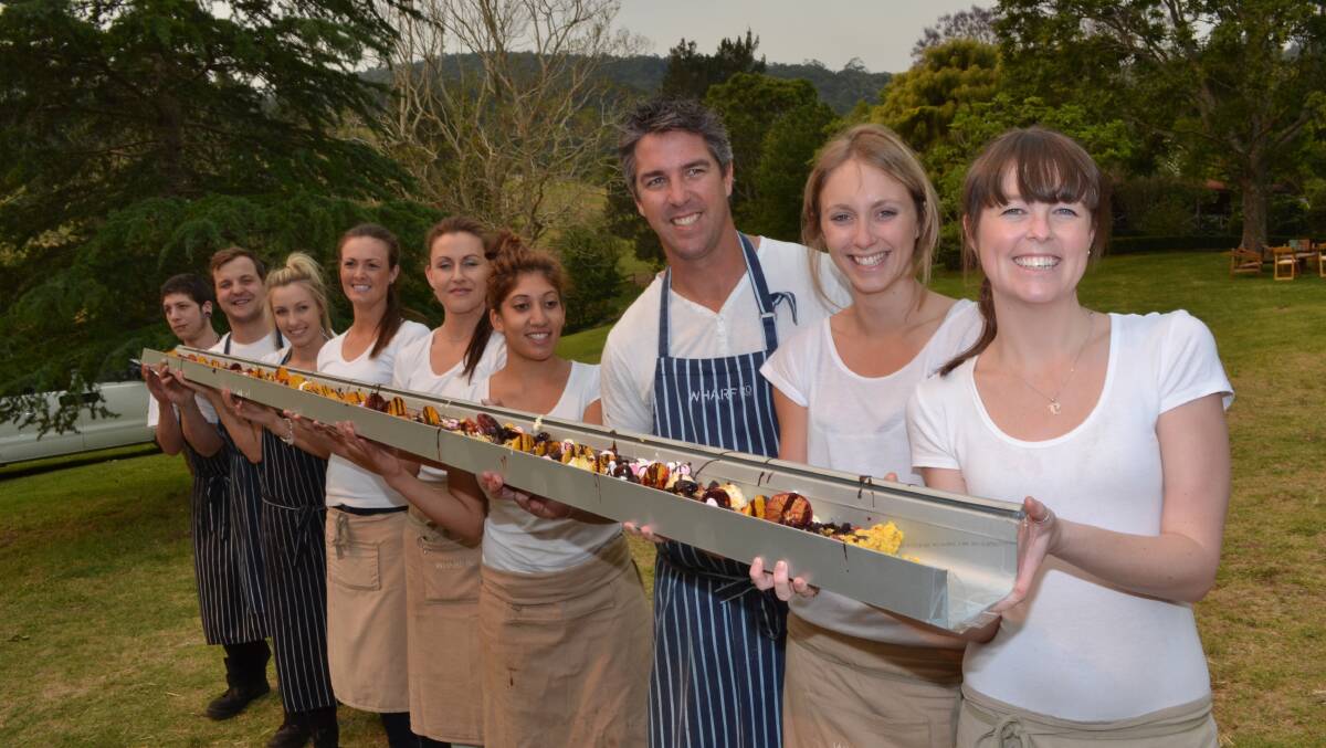 SPECIAL TREAT: Bayden Tuckley, Brent Strong, Ashleigh Caddell, Alycia Targa, Gabby Moore, Brittany Sukkar, Wharf Rd restaurateur David Campbell, Beccy Moore and Phoebe Cupples carry the gutter ice cream sundae dessert to diners, which will be on the menu again at The Sydney Morning Herald Good Food Month lunch by Wharf Rd and Millpaca Stud in Berry next month.