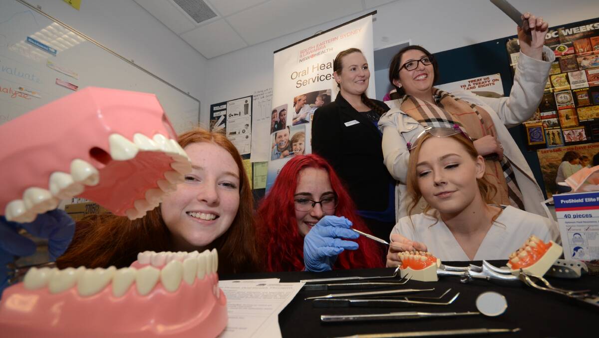 WORKING ON IT: Nowra High School year 10 students Alana Cusack and Piper Hammond get the inside running on a career in dentistry with Sarah Wood, Trolisa Knudsen and Laura Righetto from the Nowra Dental Clinic at the Shoalhaven Careers Expo.