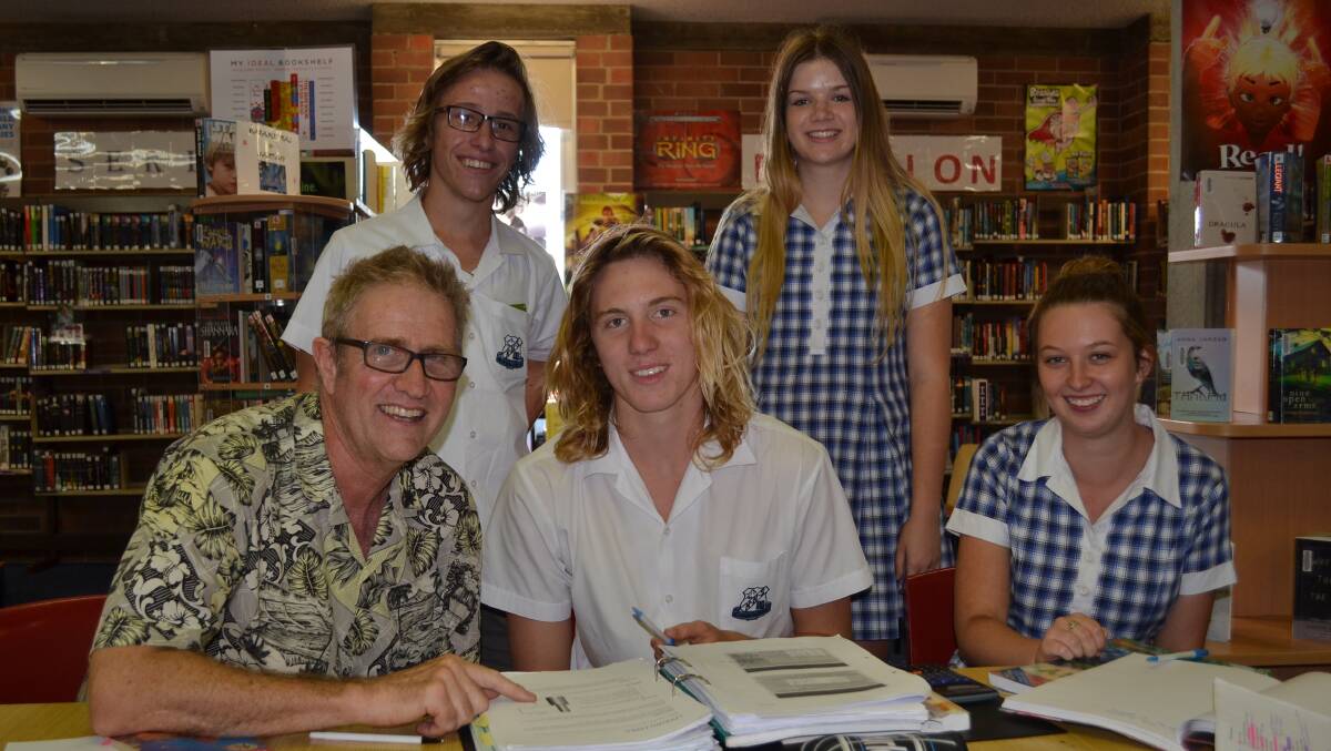 STUDIOUS: Nowra High School year 11 adviser Paul Murphy runs through work with students Rohan Corrigan, Jack Westley, Abby Anstiss and Paige Chessher at the Nowra High homework centre.