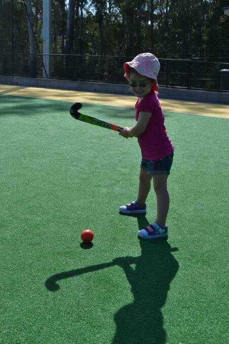 TRYING OUT: Asha Finlay from South Nowra tries her hand at hockey during the Shoalhaven Hockey women’s come and try day.