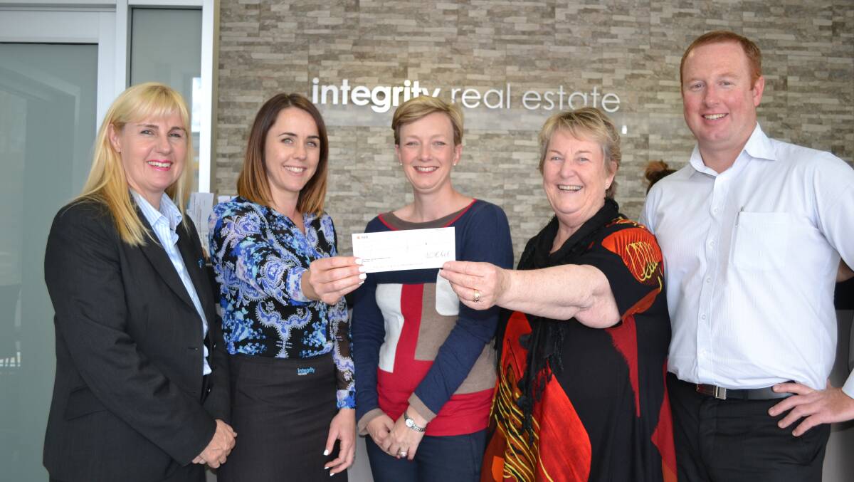 FITTING LEGACY: Integrity Real Estate directors Cherylee Elliott (Berry), Kelly Pritchard (Nowra) and Able Walsh (Jervis Bay) present the cheque to Shoalhaven Education Fund (SEF) chairperson Linda Marquis (second right) and secretary Sophie Ray (centre).