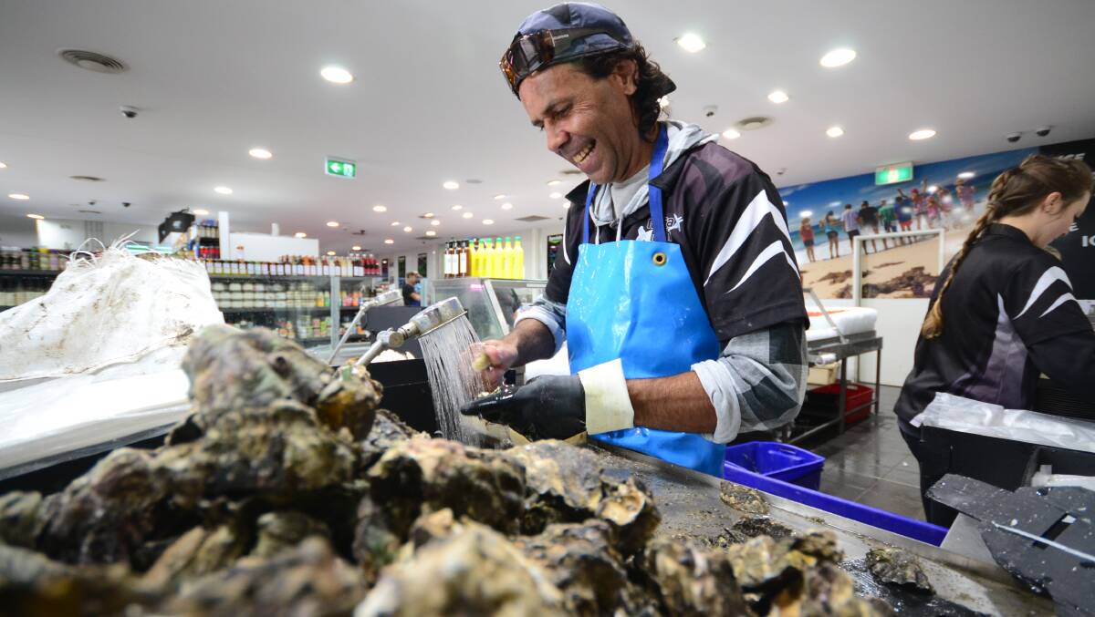 FRESH FEAST: Claydon Manton and other staff at Nowra Fresh will open up 3000 dozen oysters for Easter.