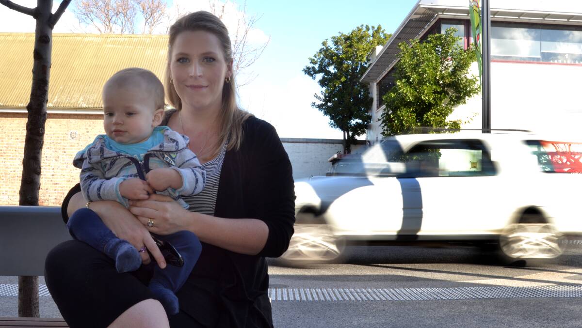 PLEASE EXPLAIN: Elizabeth Parker with baby Hamish questions for the benefit of having traffic through Junction Court.