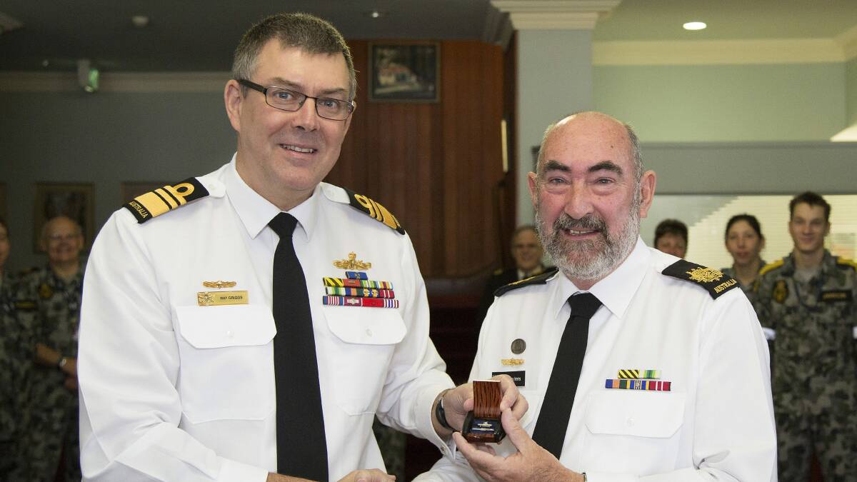 SERVICE RECOGNISED: Former Chief of Navy, Vice-Admiral Ray Griggs presents Warrant Officer Terry Imms with the Federation Star for 40 years of service. Photo: YURI RAMSEY
